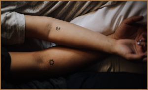 Another match would be this sun and moon tattoo