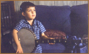 A young photo of Kelley from The Madness and The Mandolin