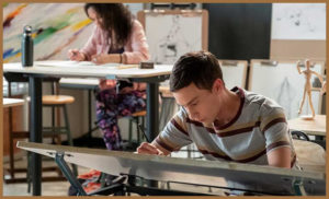Sam from Atypical studying in his scientific arts class
