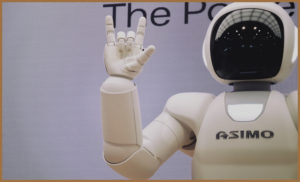 A robot waving hello to a group of autistic children