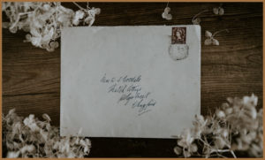 A letter on a floral background