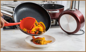 Peppers falling out of a frying pan