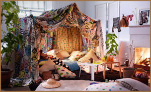 A sensory den made of blankets and pillows
