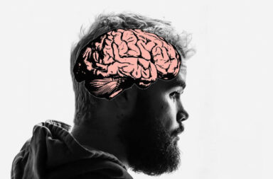 A man in black and white with a brain displayed