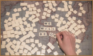 A Scrabble board that says 'we will be ok'
