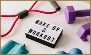 A sign that says 'wake up and workout'